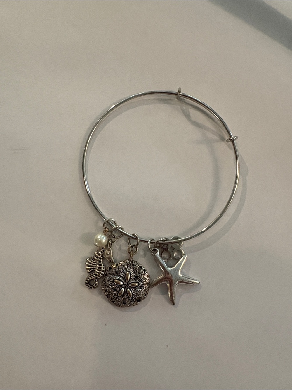 Silver Toned Beach Charm Bangle Bracelet with Starfish and Sand Dollar